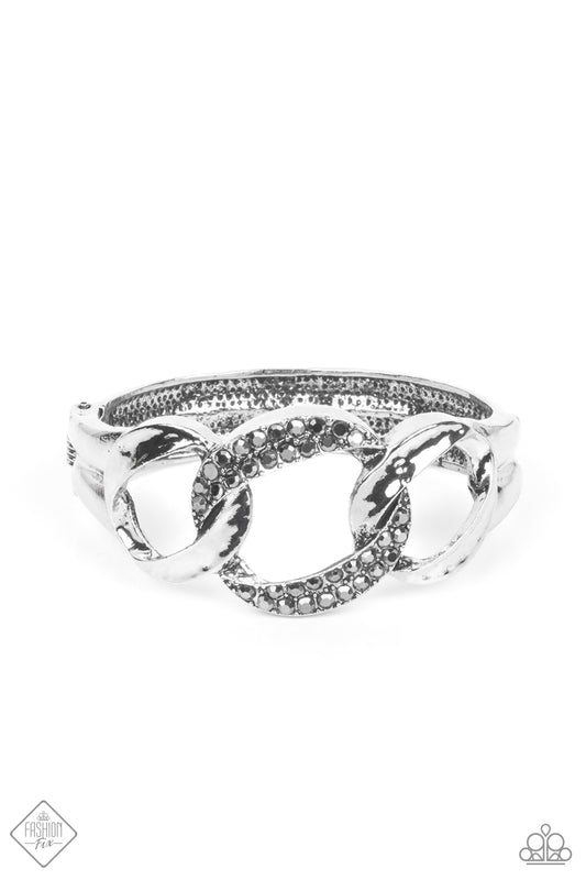 Paparazzi Accessories-BOMBSHELL Squad Silver Interlock Hematite Rhinestone Bracelet