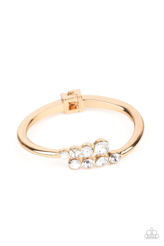 Paparazzi Accessories-Defying Dazzle Gold Glittery Rhinestone Bracelet